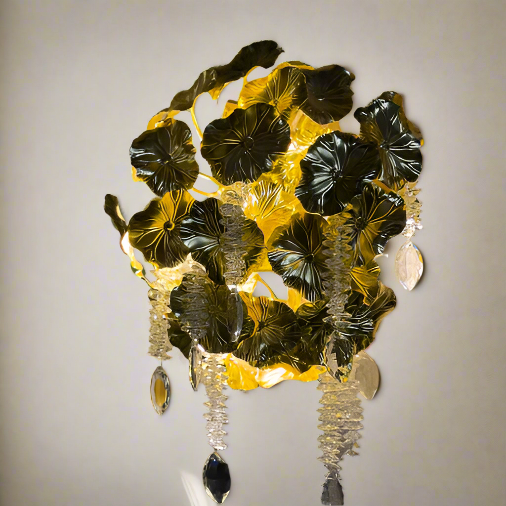 Decorative wall light fixture with leaf-like design on a textured wall.