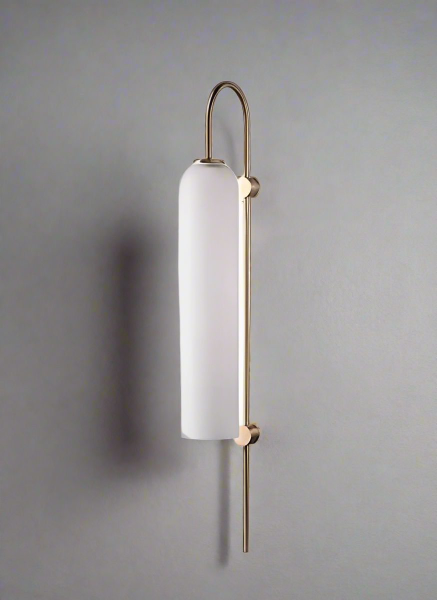 Wall-mounted light fixture with white shade and gold accents on a white background