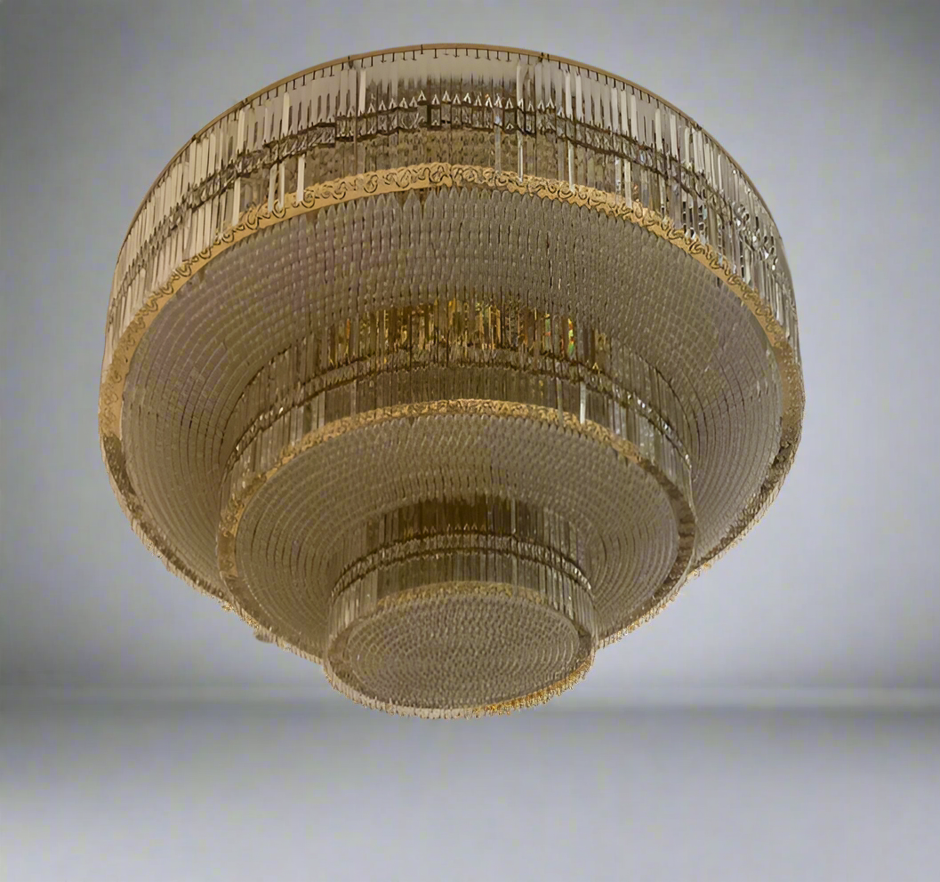 Luxurious chandelier hanging from a ceiling with a  design.