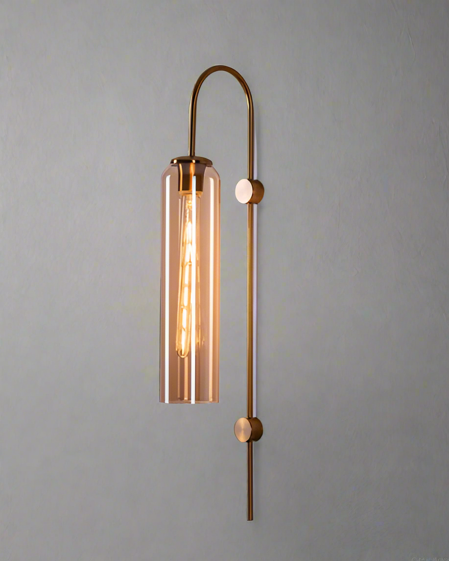 Modern wall sconce with gold finish and glass