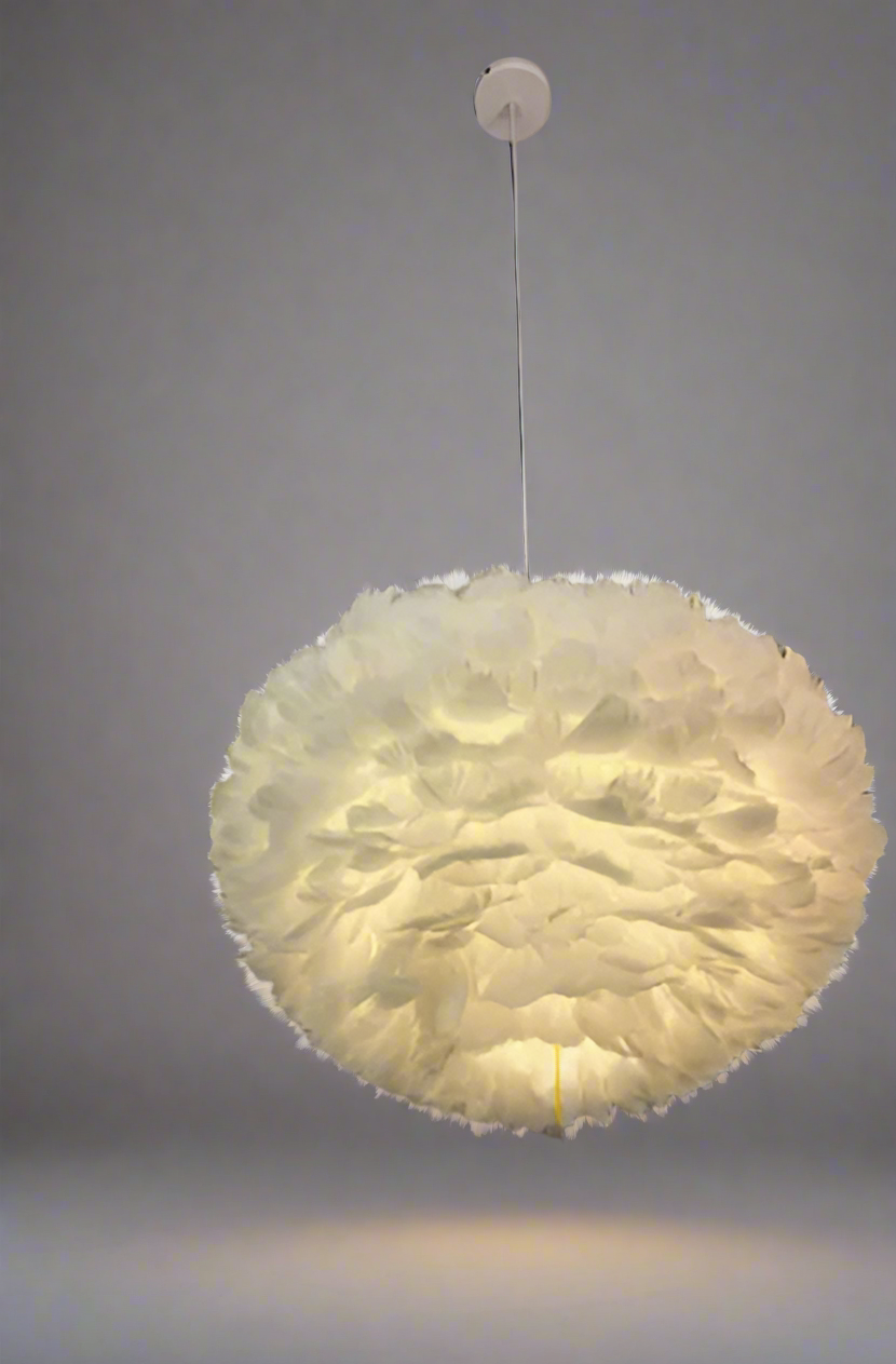 Round, feather-like pendant light hanging from a ceiling.
