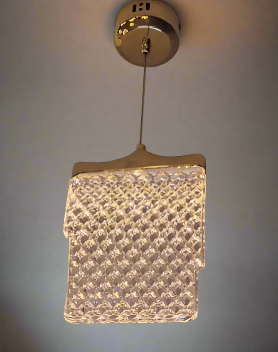 Square crystal pendant light fixture hanging from a ceiling