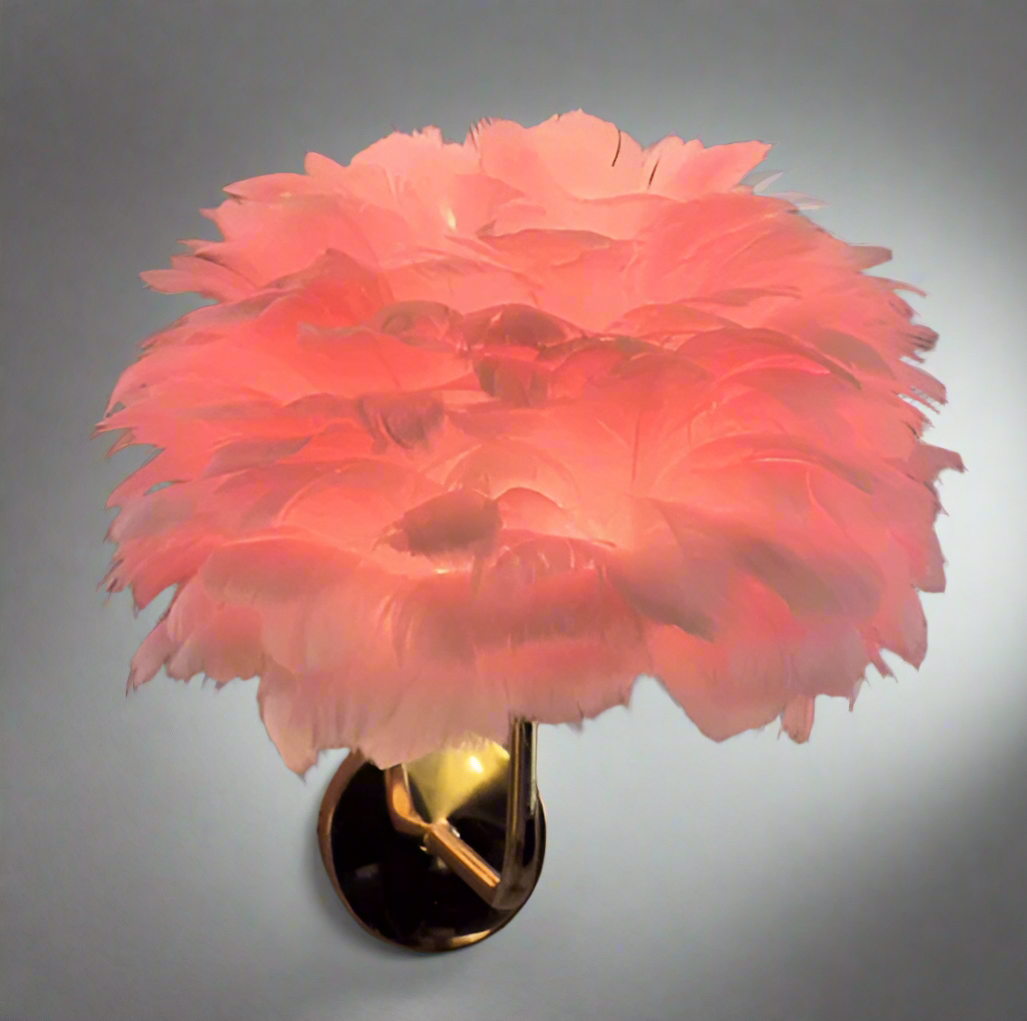 Pink feathered wall light fixture on a neutral background